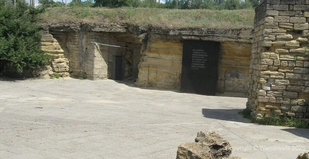 Entrance to Odesa’s catacombs with rugged stone surroundings
