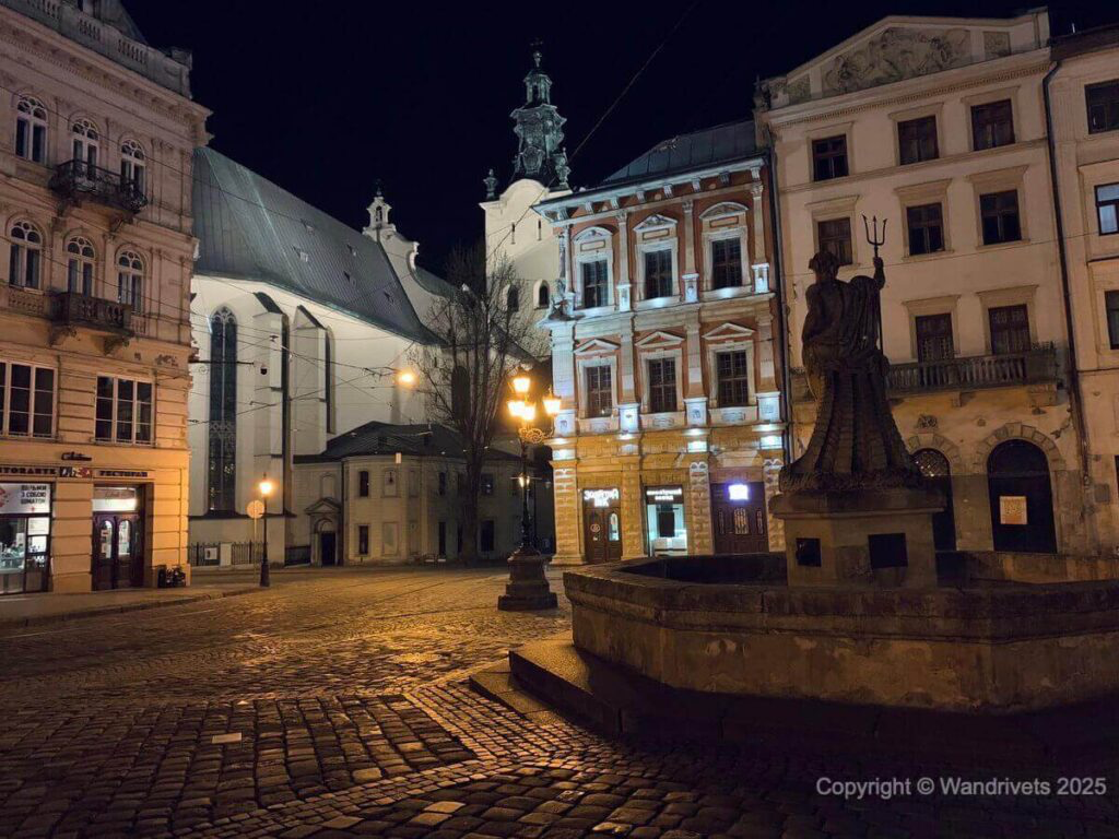 Rynok Square in Lviv, glowing at dusk with historic architecture