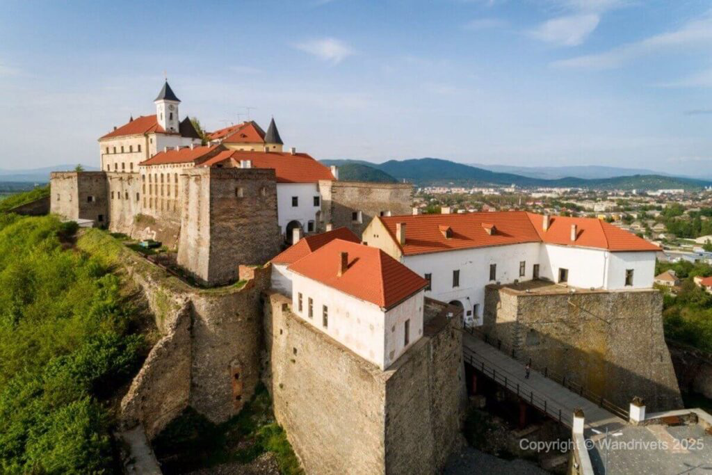 Palanok Castle in Mukachevo, surrounded by scenic Carpathian hills